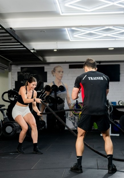 Why Group Training with Live Coaches Beats Screen-Only Workouts Every Time